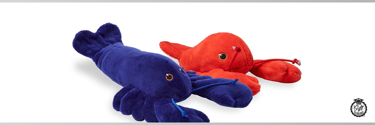 A red and a blue lobster plush sat on a white background